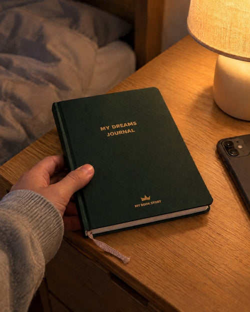 My Dreams Journal placed on a nightstand