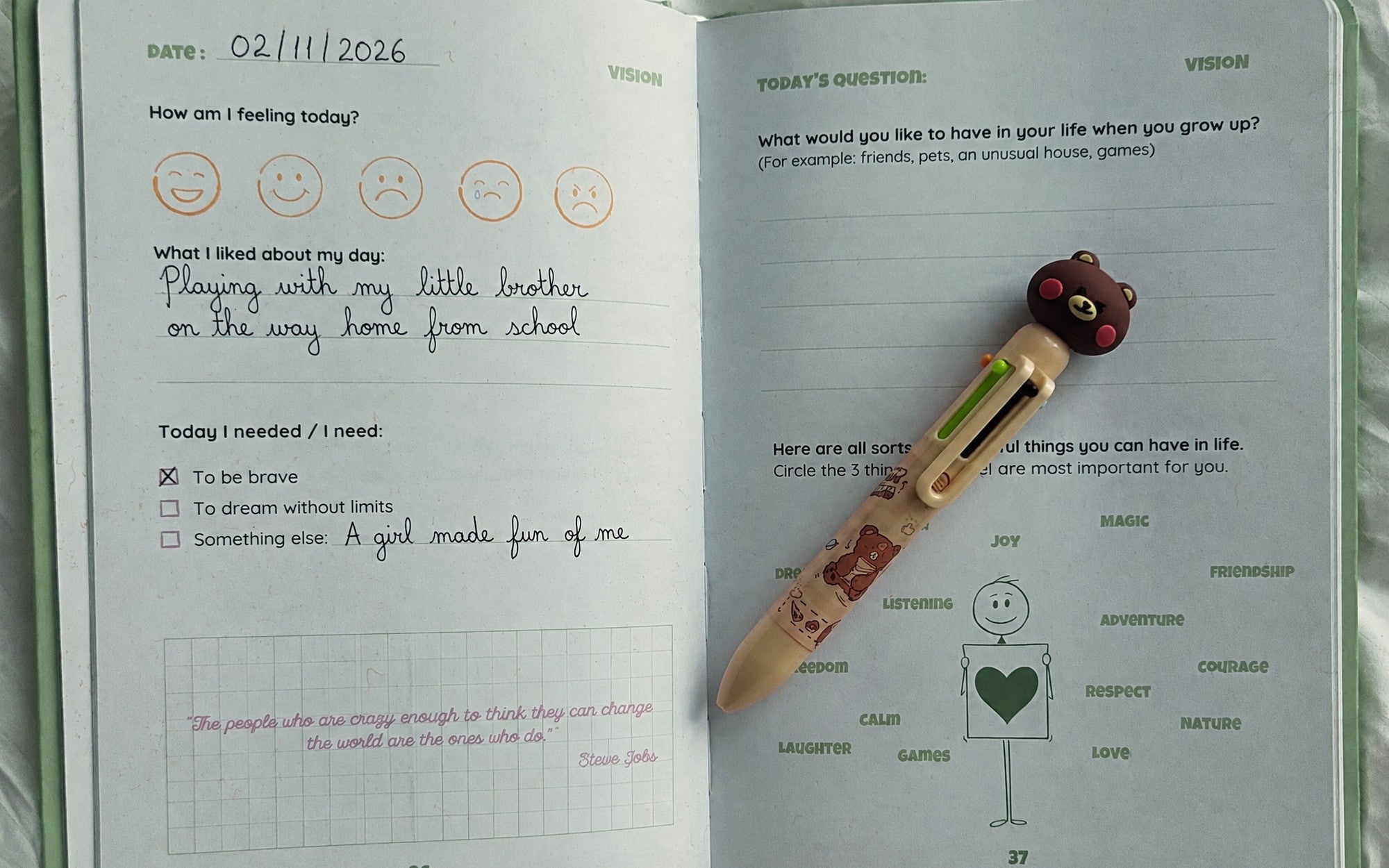 My Confidence Journal open on a filled-in double page